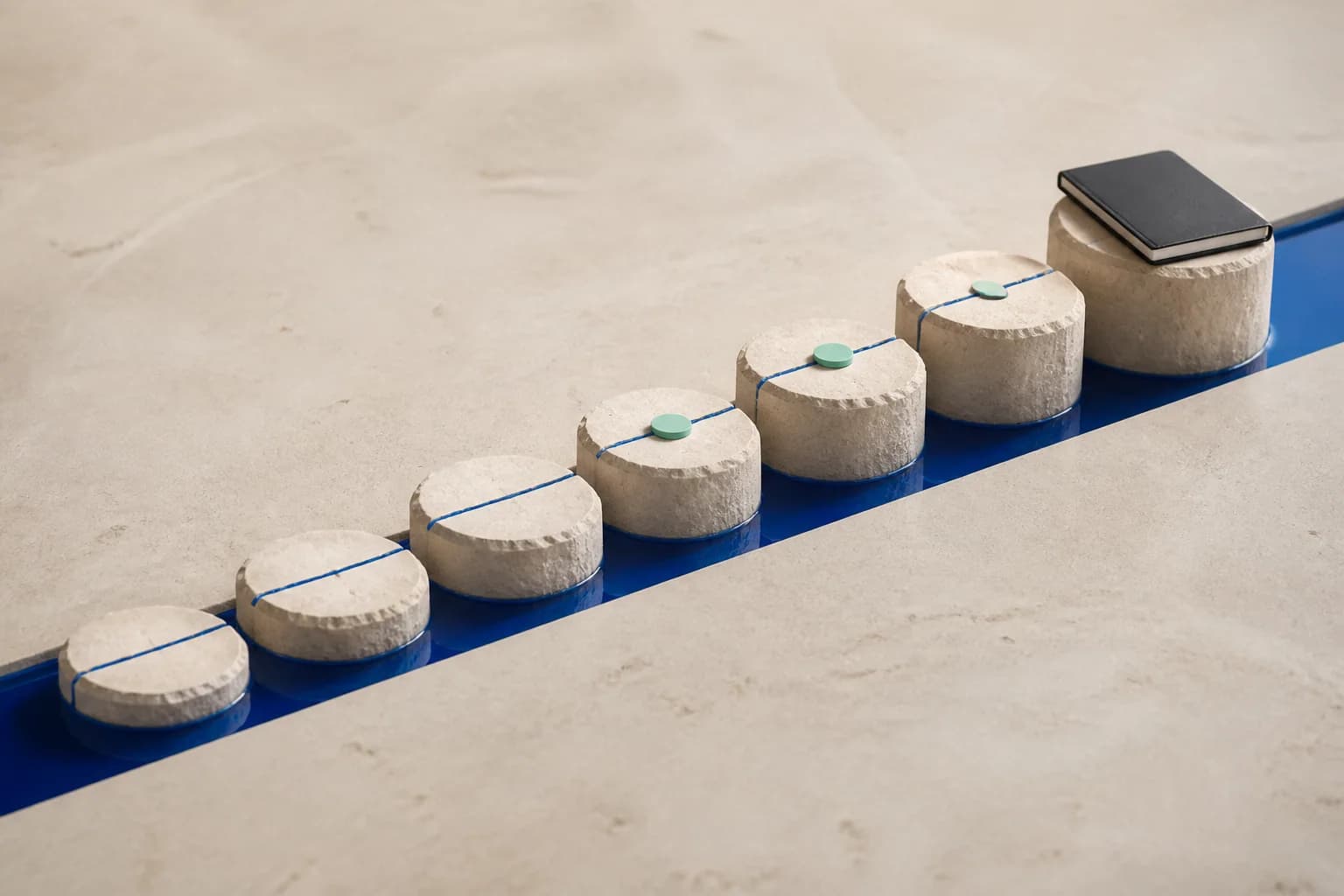 Seven-stage stone sequence representing the LaunchBase managed operating model